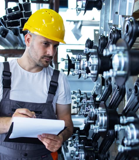 Contract manufacturing capabilities - worker in helmet working on a factory